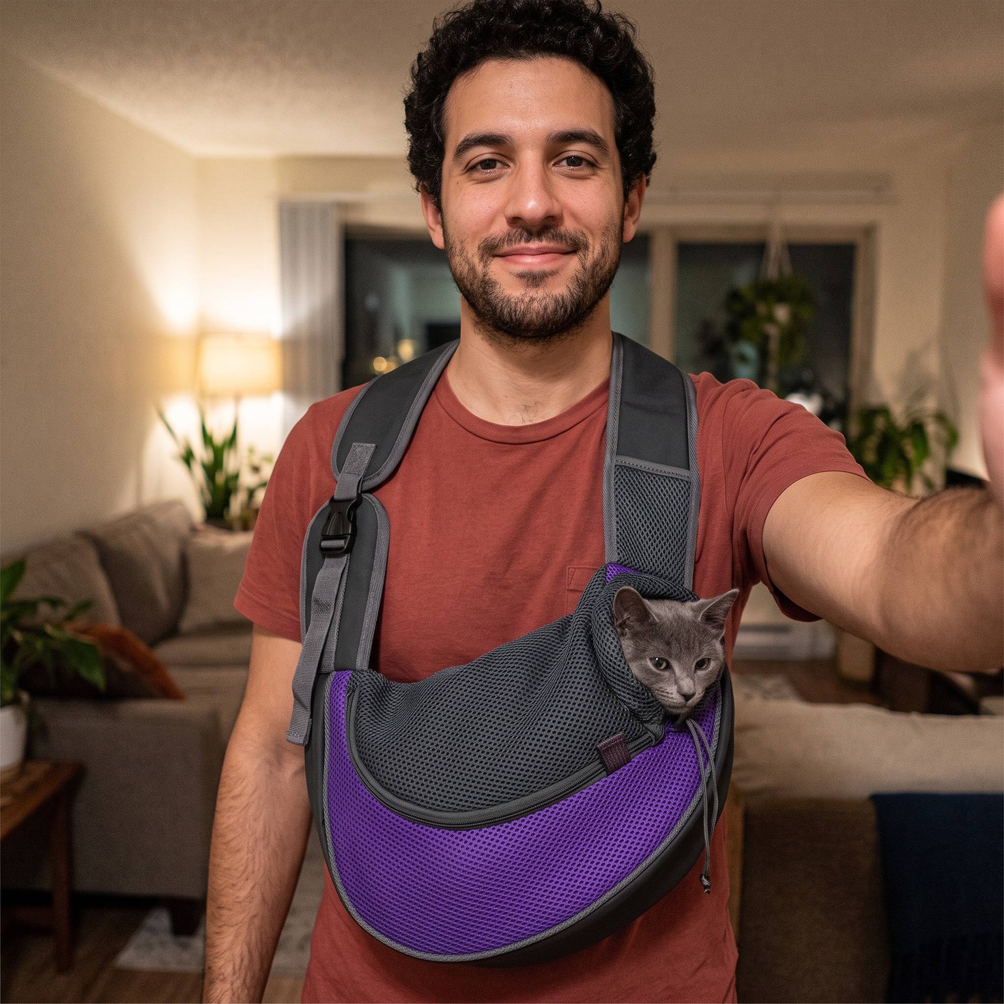 Apartment selfie with a purple sling and small cat